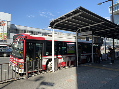 In front of the bus stop at the south exit of Keihan Hirakata-shi Station